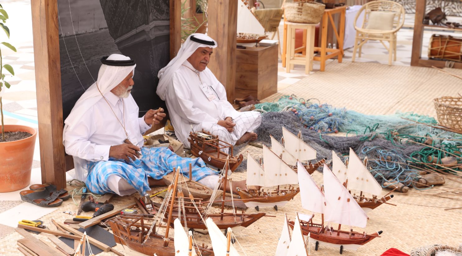 The public interacts with indigenous practices displayed at Earthna Village at Barahat Msheireb
