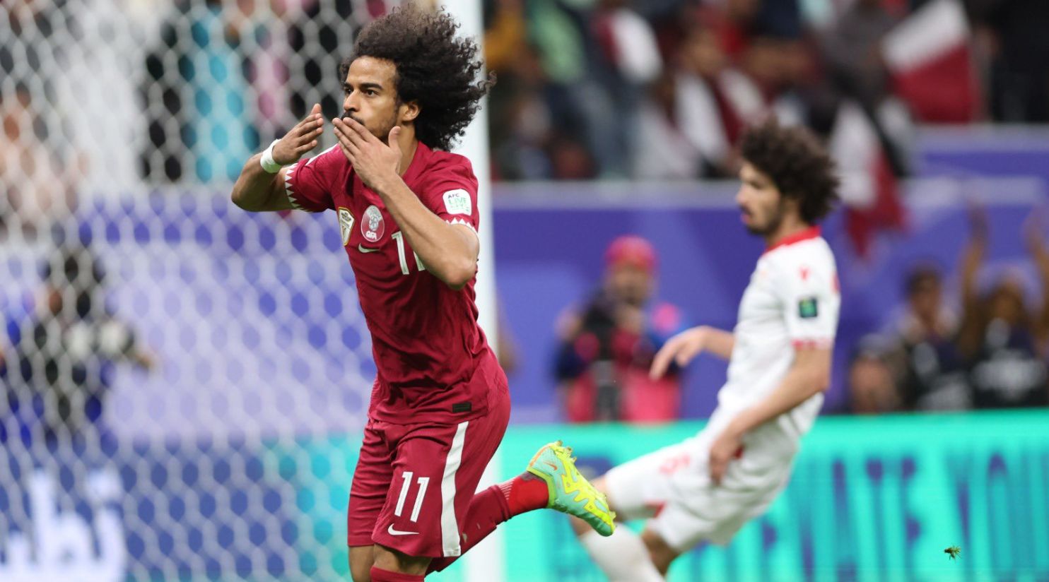 Qatar beats Tajikistan to become first team to progress to knockout phase