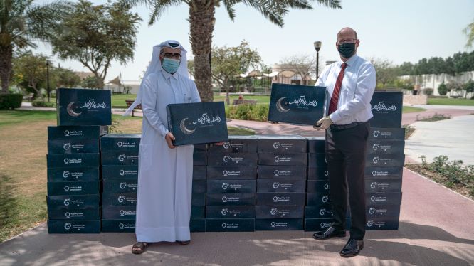 DFC partners with QC to donate 1000 boxes of essential Ramadan food supplies